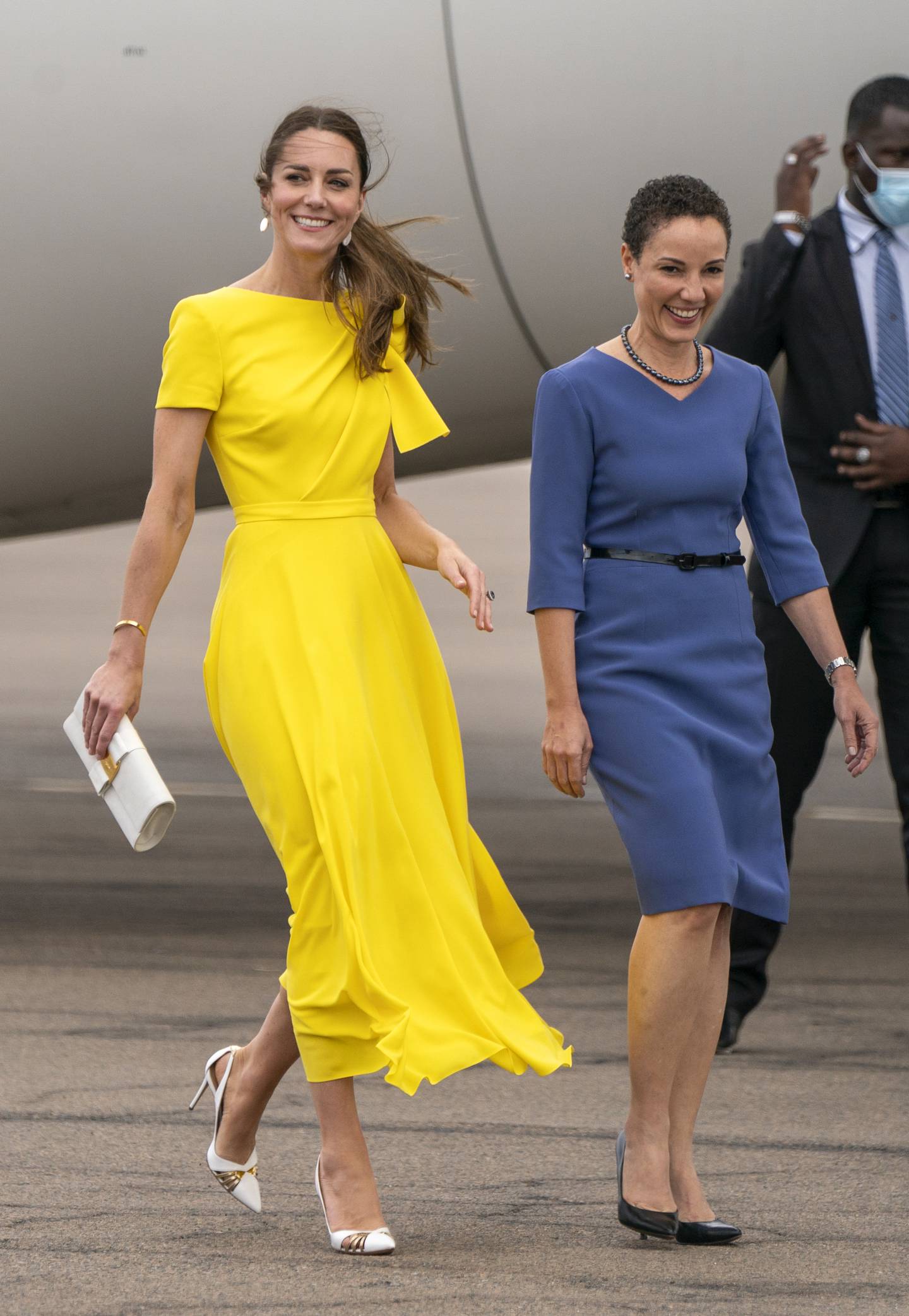 The Duchess of Cambridge with Jamaica's Minister of Foreign Affairs and Foreign Trade Kamina Johnson-Smith at Norman Manley International Airport in Kingston, Jamaica, on March 22, 2022.