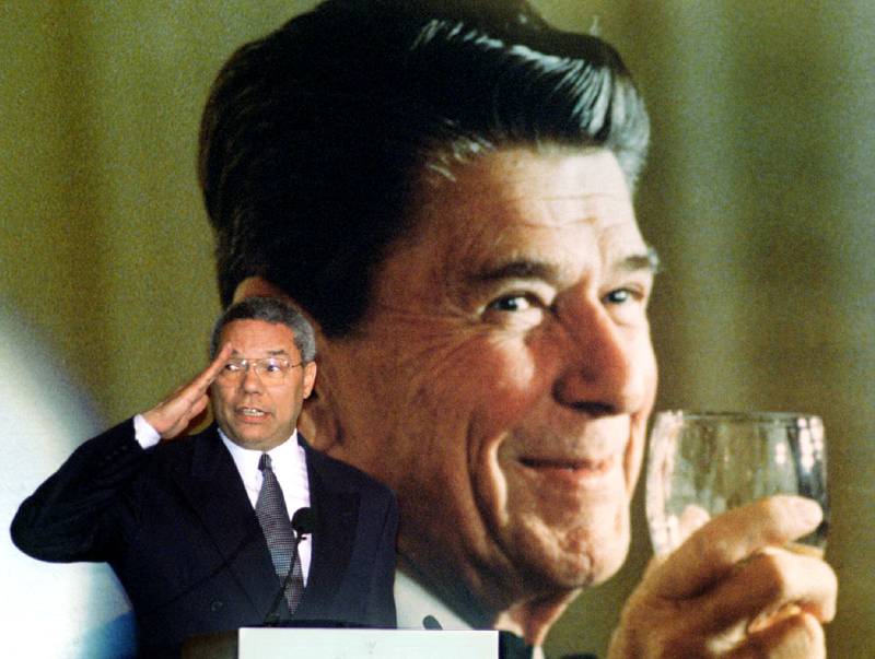 Powell salutes his former boss, ex-US president Ronald Reagan, at a party February 1996 in honour of Reagan's 85th birthday. Reuters