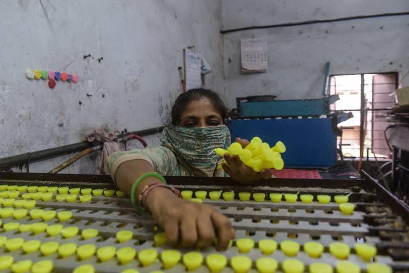 A worker at a candle making shop in Ahmedabad. AFP