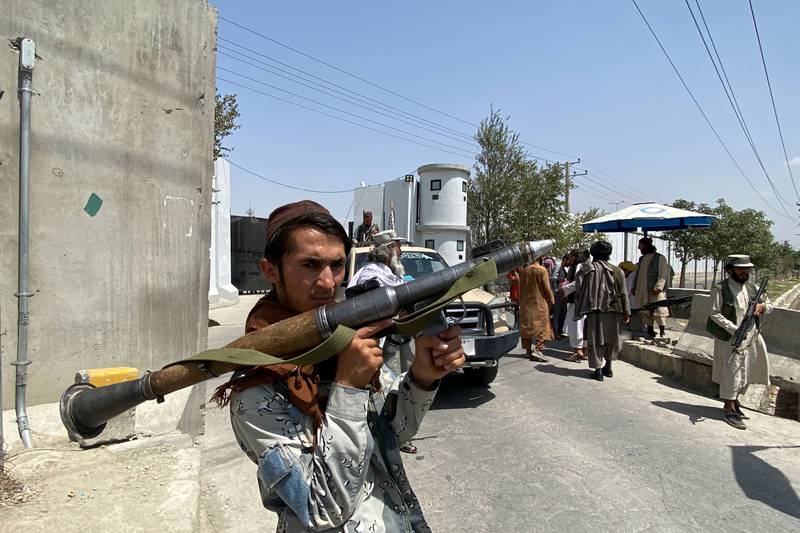 A Taliban fighter keeps watch outside the Interior Ministry in Kabul. AFP
