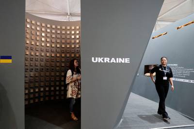 Participants visit the Ukrainian pavillon. AFP