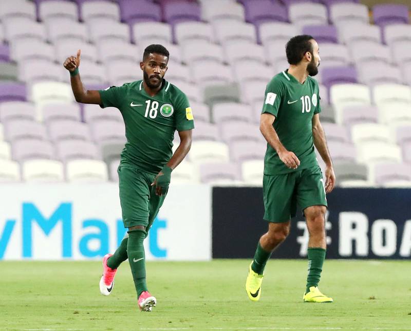 Al Ain, United Arab Emirates - August 29th, 2017: Saudi's Nawaf Alabid (L) scores from a penalty during the World Cup qualifying game between UAE v Saudi Arabia. Tuesday, August 29th, 2017 at Hazza Bin Zayed Stadium, Al Ain. Chris Whiteoak / The National