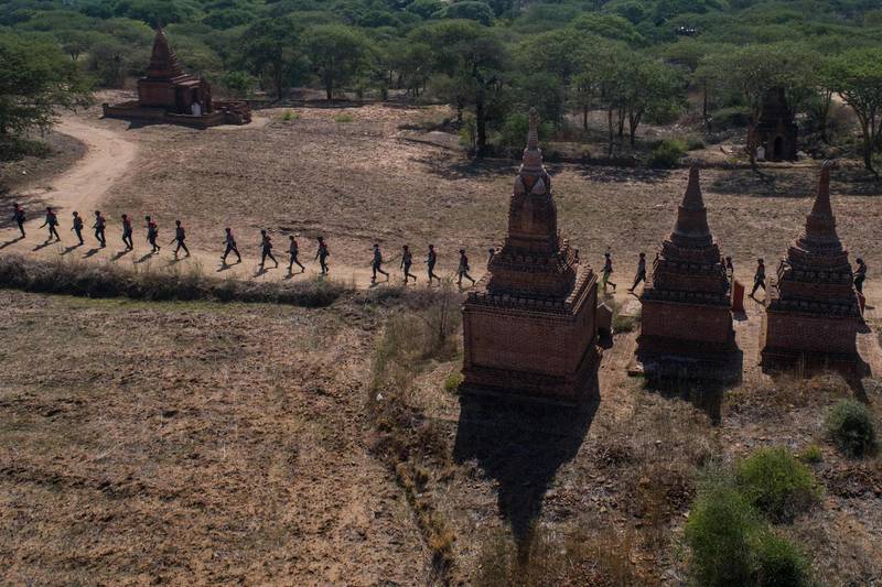 Members of a police squad patrolling a temple complex in Bagan, Mandalay Region, Myanmar.  AFP
