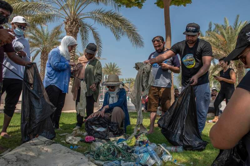 Volunteers show the rubbish gathered from Abu Dhabi's mangroves during a clean-up.