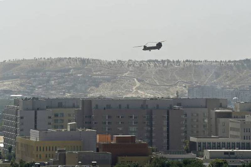 A US Chinook military helicopter flies over the US embassy in Kabul.