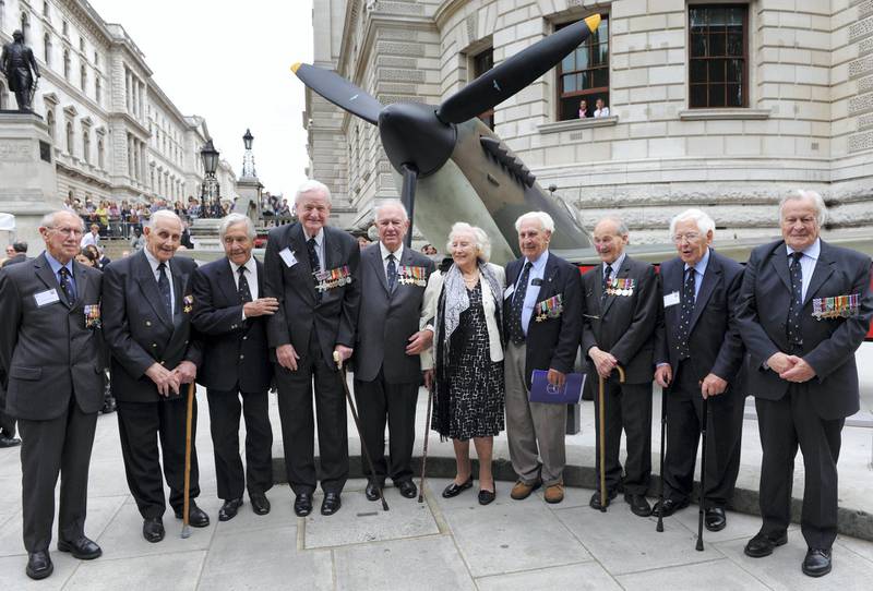 epa02294355 Battle of Britain veterans pose for photos with Dame Vera Lynn (C) outside the Churchill War Rooms, in London, England, Britain, on 20 August 2010. The event is part of a series of memorial events taking place throughout the year to mark the 70th anniversary of the historic mission, known as the Battle of Britain, during which Royal Air Force fighter squadrons fought German Luftwaffe bombers that pounded Britain's cities and airfields as preparation for a planned invasion. The Battle of Britain is considered by many to be a major turning point in World War 2.  EPA/FACUNDO ARRIZABALAGA *** Local Caption *** 02294355