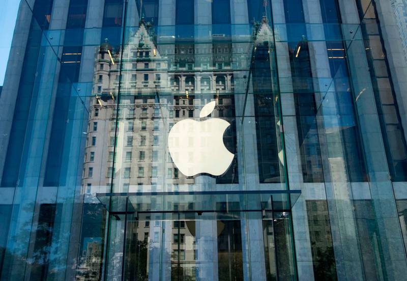 (FILES) This file photo taken on September 14, 2016 shows the Apple logo at the entrance to the Fifth Avenue Apple store in New York.
Apple announced January 17, 2018 it would pay some $38 billion in taxes -- likely the largest payment of its kind -- on profits repatriated from overseas as it boosts investments in the United States.The iPhone maker said in a statement it plans to use some of its foreign cash stockpile of more than $250 billion, which qualifies for reduced tax rates under a recent bill, to invest in new projects, with estimated investments of $75 billion in the US. / AFP PHOTO / Don EMMERT