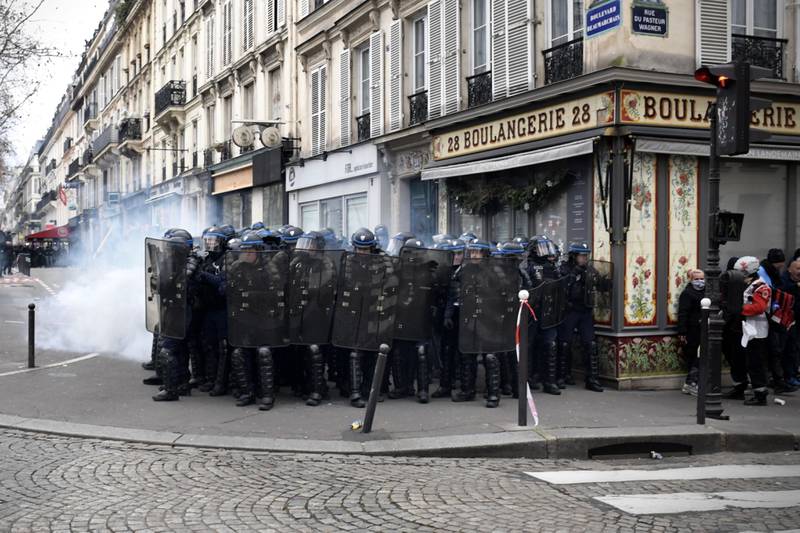 Riot police regroup as tension mounts on the streets of Paris and elsewhere in France. Bloomberg