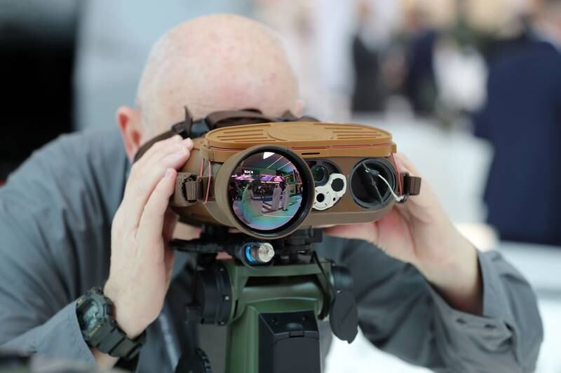Didier Bonnet looks through a pair of multi-function binoculars made by Safran