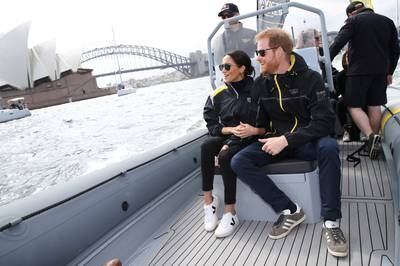 SYDNEY, AUSTRALIA - OCTOBER 21:  Prince Harry, Duke of Sussex and Meghan, Duchess of Sussex sail across Sydney harbour  at Sydney Olympic Park on October 21, 2018 in Sydney, Australia. The Duke and Duchess of Sussex are on their official 16-day Autumn tour visiting cities in Australia, Fiji, Tonga and New Zealand.  (Photo by Pool/Samir Hussein/WireImage)