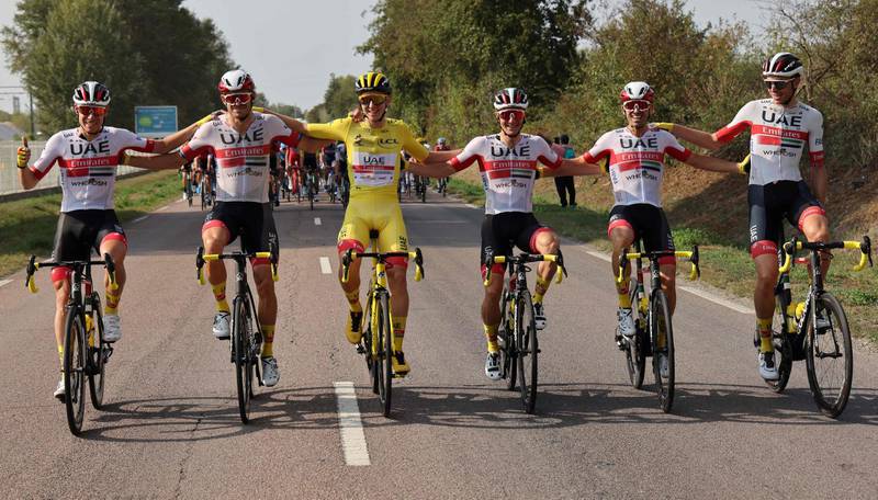 Team UAE Emirates rider Slovenia's Tadej Pogacar wearing the overall leader's yellow jersey (3rd-L) and Team UAE Emirates riders ride during the 21st and last stage of the 107th edition of the Tour de France cycling race, 122 km between Mantes-la-Jolie and Champs Elysees Paris. AFP