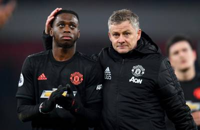 LONDON, ENGLAND - JANUARY 01: Ole Gunnar Solskjaer, Manager of Manchester United speaks to Aaron Wan-Bissaka of Manchester United after the Premier League match between Arsenal FC and Manchester United at Emirates Stadium on January 01, 2020 in London, United Kingdom. (Photo by Clive Mason/Getty Images)