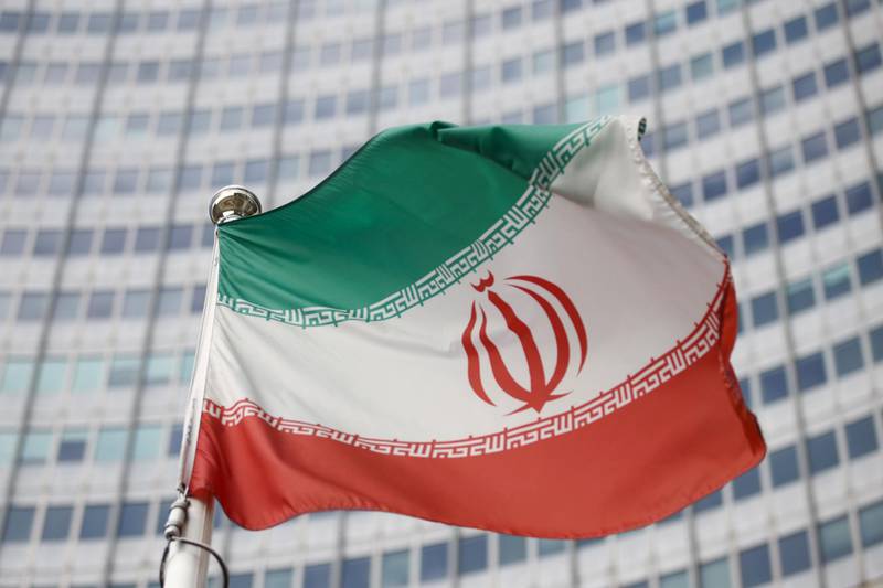 FILE PHOTO: The Iranian flag waves in front of the International Atomic Energy Agency (IAEA) headquarters, before the beginning of a board of governors meeting, amid the coronavirus disease (COVID-19) outbreak in Vienna, Austria, March 1, 2021. REUTERS/Lisi Niesner/File Photo