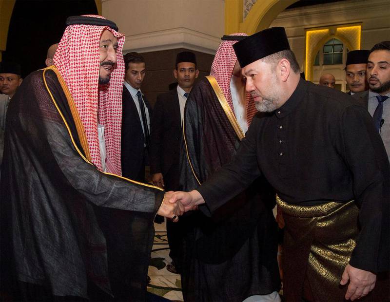 Saudi Arabia’s King Salman shakes hands with Malaysian King Muhammad V in Kuala Lumpur, Malaysia. Courtesy of Saudi Royal Court / Reuters