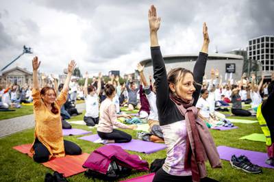 Participants take part in a mass yoga event, to celebrate the International Yoga Day, in Amsterdam, The Netherlands.  Remko de Waal / EPA