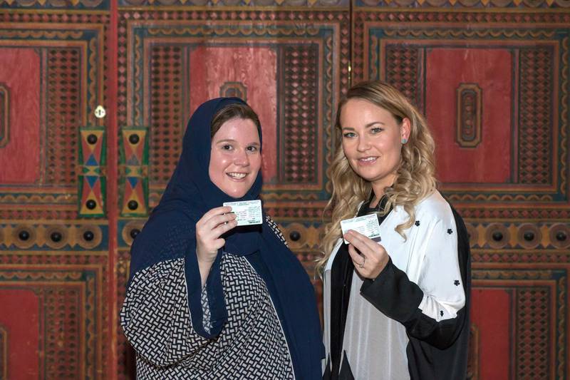 Laura Alho and Kelly Downing show off their new driving licences in Riyadh. Abdul Ahad for The National.