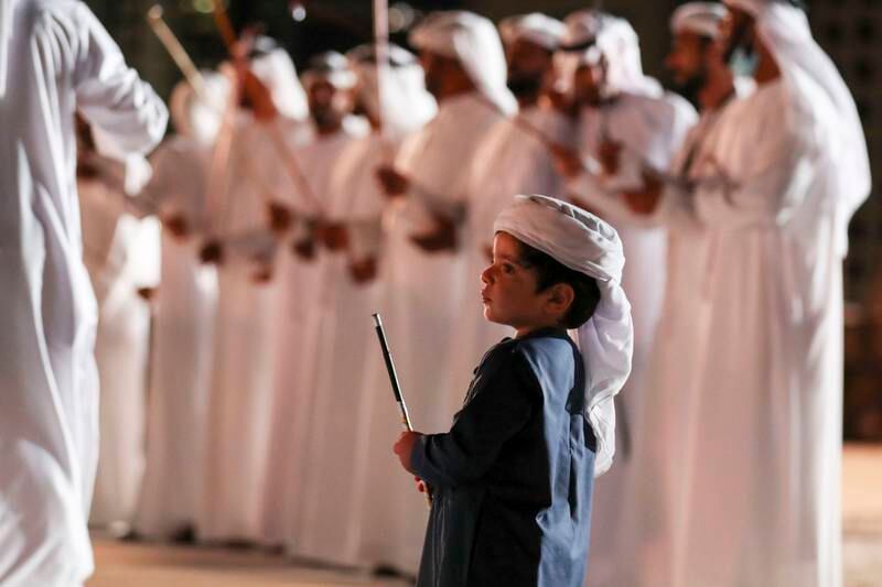 An Emirati boy during the heritage singing and dancing at the opening of the Al Hosn Festival.