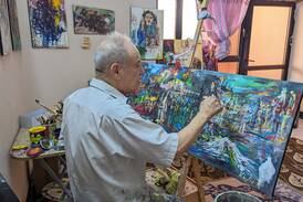 Iraqi artist Khaled Ridha, 70, paints in his studio in Kirkuk in the heart of disputed territory. Photo: Khazan Jangiz