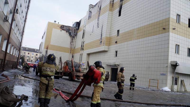 Members of the Emergency Situations Ministry work to extinguish a fire in a shopping mall in the Siberian city of Kemerovo, Russia March 26, 2018. Russian Emergencies Ministry/Handout via REUTERS. ATTENTION EDITORS - THIS IMAGE WAS PROVIDED BY A THIRD PARTY. NO RESALES. NO ARCHIVE.