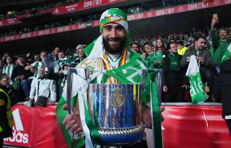 Real Betis forward Nabil Fekir celebrates with the Copa del Rey trophy. Getty