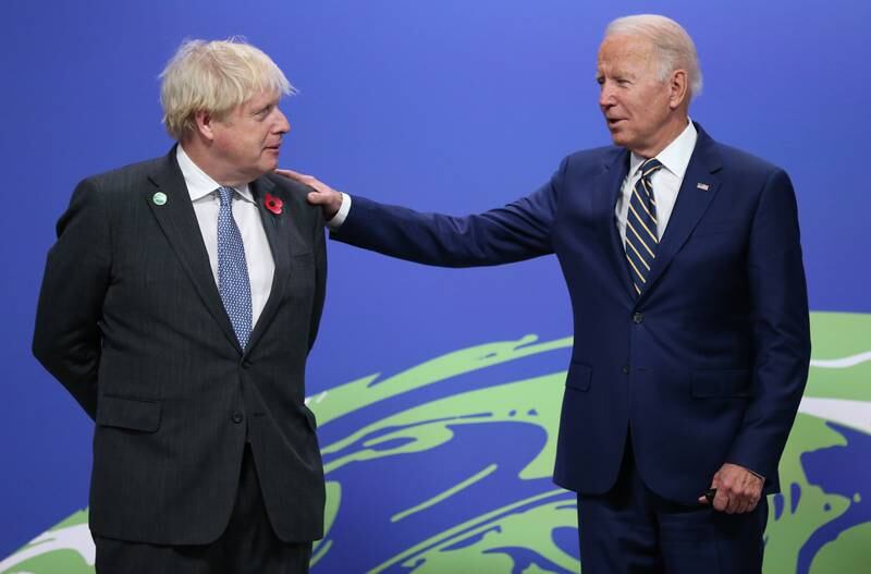 British Prime Minister Boris Johnson greets US President Joe Biden as leaders arrive to attend the Cop26 Sumimt. EPA