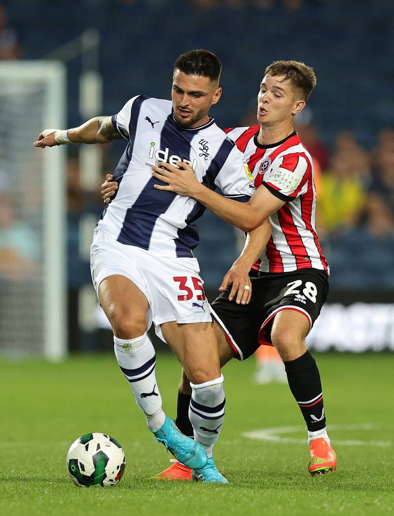 Sheffield United's James McAtee challenges Okay Yokuslu of West Brom in a Carabao Cup First-Round match on August 11, 2022. Getty 
