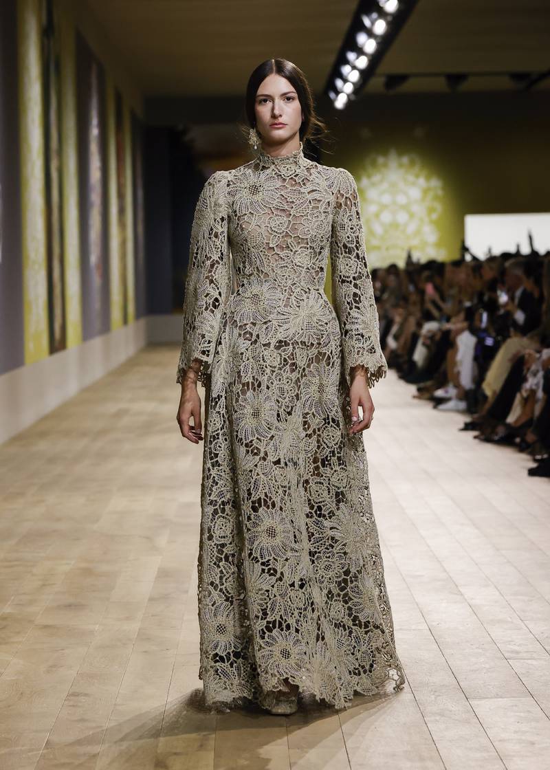 High-necked, floor-length gowns were sculpted from stiff embroidery.