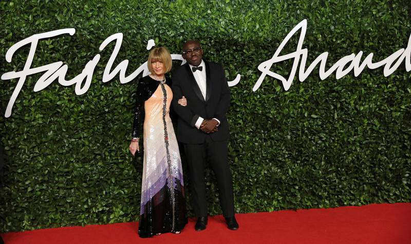 Vogue chief editor Anna Wintour (L) and British editor-in-chief of British Vogue magazine Edward Enninful  poses on the red carpet upon arrival at The Fashion Awards 2019 in London on December 2, 2019. The Fashion Awards are an annual celebration of creativity and innovation will shine a spotlight on exceptional individuals and influential businesses that have made significant contributions to the global fashion industry over the past twelve months. - RESTRICTED TO EDITORIAL USE -  NO MARKETING NO ADVERTISING CAMPAIGNS
 / AFP / ISABEL INFANTES / RESTRICTED TO EDITORIAL USE -  NO MARKETING NO ADVERTISING CAMPAIGNS
