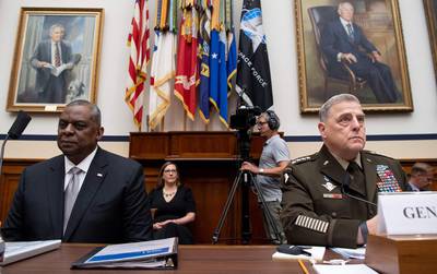 General Mark Milley (R), Chairman of the Joint Chiefs of Staff, and US Secretary of Defense Lloyd Austin III (L) testifies on the department's fiscal year 2022 budget request during a House Armed Services Committee hearing on Capitol Hill in Washington, DC, on June 23, 2021. / AFP / SAUL LOEB
