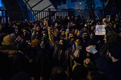 Demonstrators chant while gathering during a vigil for the victims of the Ukraine International Airlines flight that was unintentionally shot down by Iran, in Tehran, Iran, on Saturday, January 11. Bloomberg