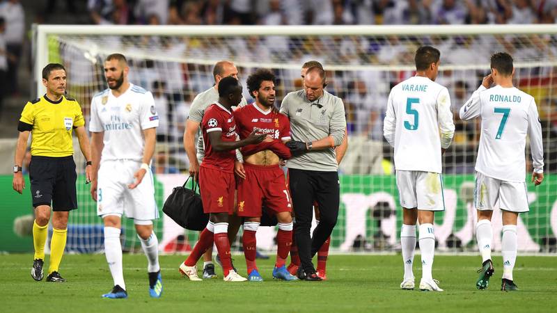 Sadio Mane of Liverpool consoles Mohamed Salah of Liverpool as he leaves the pitch injured during the UEFA Champions League Final. Shaun Botterill / Getty Images