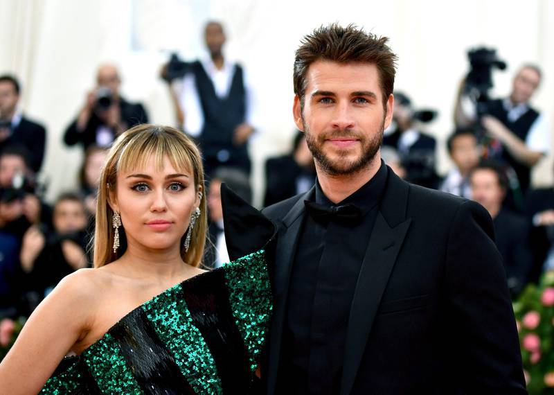 FILE - In this May 6, 2019 file photo, Miley Cyrus, left, and Liam Hemsworth attend The Metropolitan Museum of Art's Costume Institute benefit gala celebrating the opening of the "Camp: Notes on Fashion" exhibition in New York. Cyrus and Hemsworth have separated after less than a year of marriage. A representative for the singer said Saturday, Aug. 10 the pair decided a break was best while they focus on â€œthemselves and careers.â€ Cyrus and Hemsworth, who starred in â€œThe Hunger Gamesâ€ films, have been an on-and-off again couple for more than a decade. They married in December 2018.  (Photo by Charles Sykes/Invision/AP, File)
