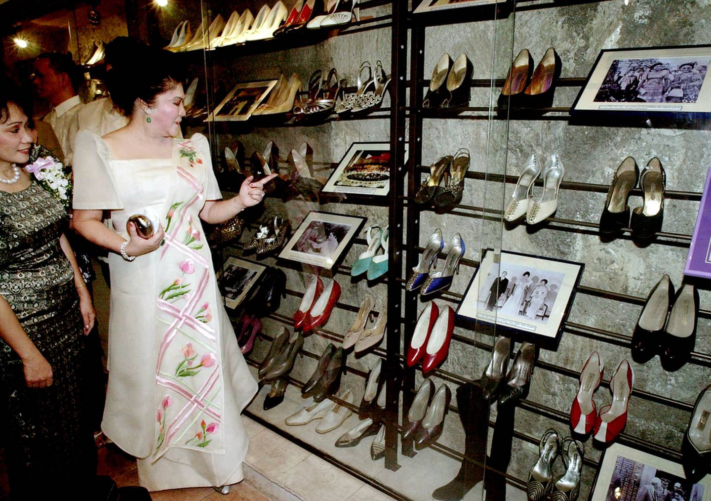 Imelda Marco, looks at her famous shoe collection after opening the Marikina Shoe Museum in 2001. AFP