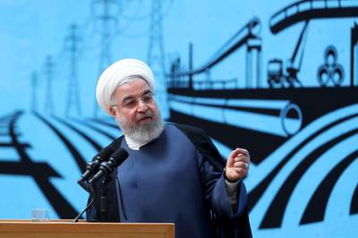 In this photo released by the official website of the office of the Iranian Presidency, President Hassan Rouhani speaks in a conference in Tehran, Iran, Monday, Aug. 26, 2019. Rouhani defended his foreign minister's surprise visit to the G-7 summit, saying he ready to go anywhere to negotiate a way out of the crisis following the US pullout from the nuclear deal. Iranian Presidency Office via AP