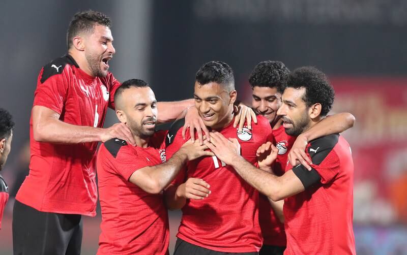 Egypt players celebrate with Mostafa Mohamed after his goal againt Guinea in the Africa Cup of Nations qualification match in Cairo. EPA