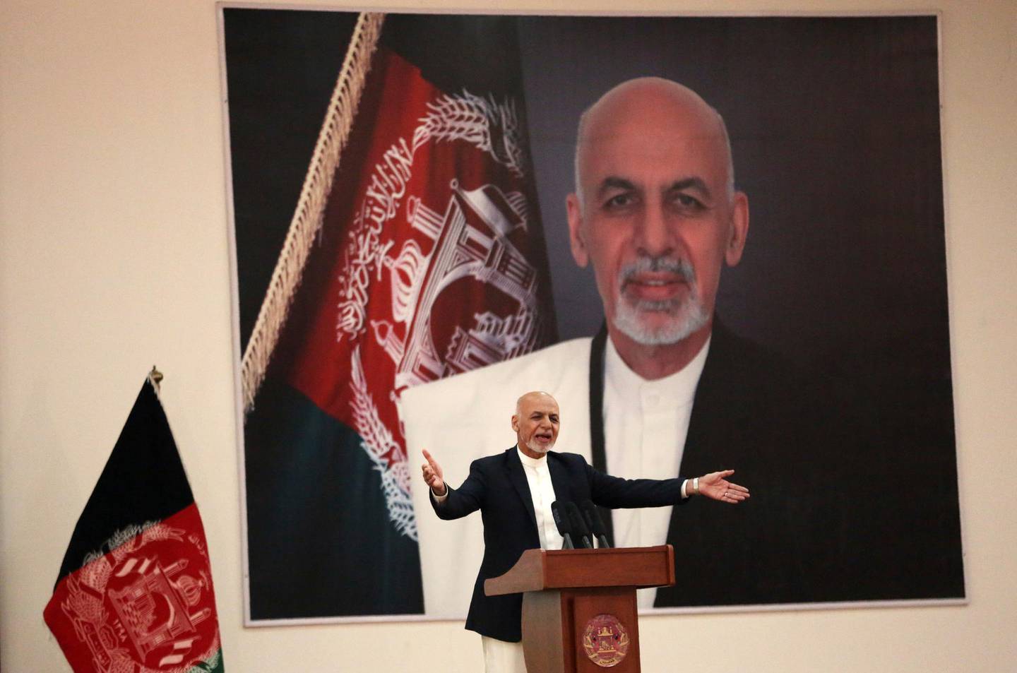 FILE - In this Sept. 9, 2019, file photo, Afghan President Ashraf Ghani speaks during a ceremony to introduce the new chief of the intelligence service, in Kabul, Afghanistan. President Donald Trump's halt to U.S.-Taliban talks looks like a gift to the beleaguered Afghan president, who has insisted on holding a key election in less than three weeksâ€™ time despite widespread expectations that a peace deal would push it aside. (AP Photo/Rahmat Gul, File)