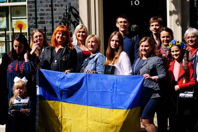 Ukrainian families outside 10 Downing Street in May. Campaigners want Prime Minister Liz Truss to make a public pledge that the accommodation and financial help on offer will continue. PA