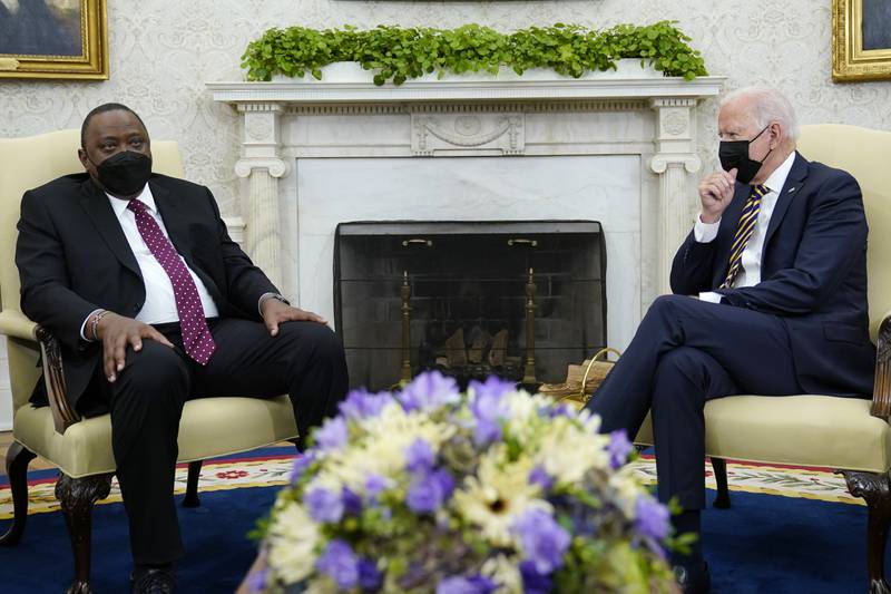 US President Joe Biden, right, listens as Kenyan President Uhuru Kenyatta, left, speaks during their meeting in the Oval Office of the White House in Washington. AP