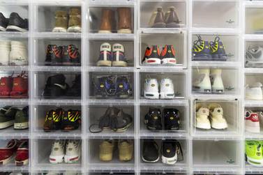 Trainers sit in stacked clear boxes at the office of Nice, an online sneaker trading platform, in Beijing. Across China, more than 10 million monthly active users frequent online-resale apps for trainers, according to Chinese data-mining company QuestMobile. Bloomberg