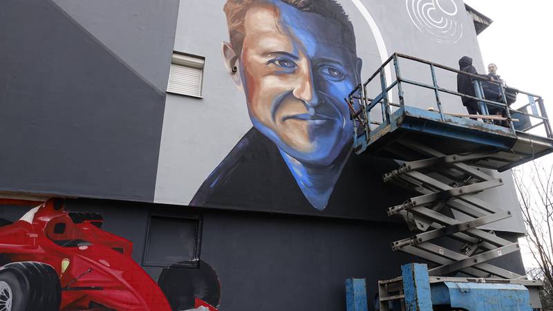 Bosnian artist Benjamin Cengic painted the mural of Michael Schumacher as a tribute to the driver's humanitarian help during and after the Bosnian war. AP