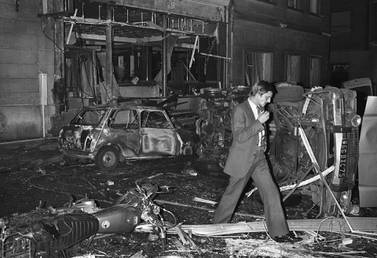 An investigator surveys the wreckage of the Paris synagogue attack in 1980. AFP