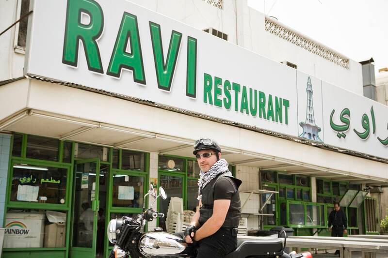 Dubai - April 26, 2009: Mark Lockwood on his motorbike outside Ravi Indian Restaurant. Lauren Lancaster / The National *** Local Caption ***  LL_26.04.09 - mark bike003.jpg