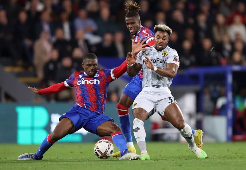 Cheick Doucoure of Crystal Palace battles for possession with Adama Traore of Wolverhampton Wanderers. Getty Images