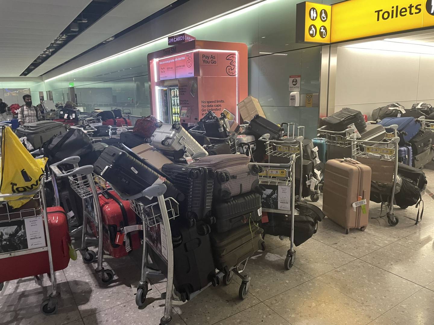 Baggage piled up at London's Heathrow Terminal 2 on June 19. PA