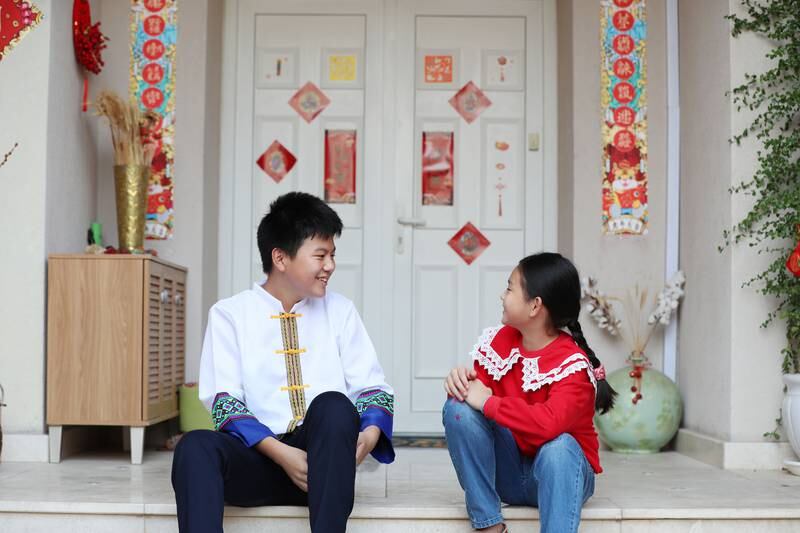 Jeffrey and Sabrina admire the Chen family's decorations at their home in The Lakes, Dubai. Chris Whiteoak / The National