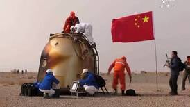 Chinese astronauts return to Earth after record space mission