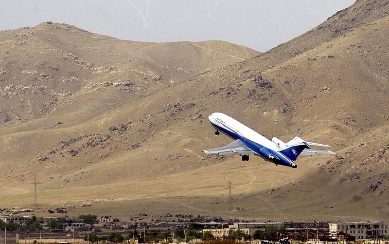 An Ariana Airlines Boeing-727 flight heading from Kabul to Islamabad takes off 12 May 2002. Afghanistan's national Ariana airline made its first flight from Kabul to the Pakistani capital Islamabad since the 11 September attacks on the United States.  AFP PHOTO/Mandel NGAN (Photo by MANDEL NGAN / AFP)