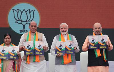 From Left, Indian Foreign Minister Suushma Swaraj, Home Minister Rajnath Singh, Indian Prime Minister Narendra Modi, Bharatiya Janata Party (BJP) president Amit Shah release BJP's manifesto for the upcoming general elections in New Delhi, India, Monday, April 8, 2019. India's general elections are scheduled to be held in seven phases starting from April 11. Votes will be counted on May 23. (AP Photo/Manish Swarup)