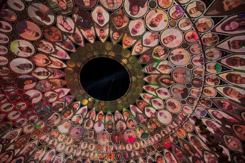 The Al Wasl dome is displayed with different faces at the Police Academy Graduation in celebration of the country's 50th anniversary.  Ruel Pableo / The National
