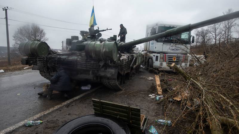A Ukrainian serviceman on a captured Russian tank in the northern Kharkiv region. Reuters